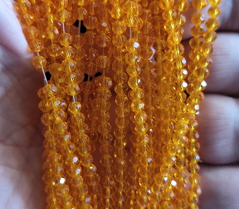 Glass bead string, faceted, rondelle, 3x4mm, Translucent Orange, 40cm - Image 2