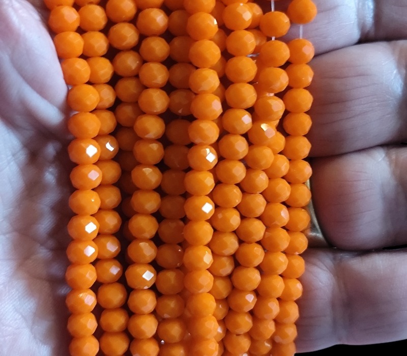 Glass bead string, faceted, rondelle, 5x6mm, Not Translucent Orange, 40cm - Image 2