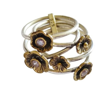 Pink tourmaline round cut in center of brass plated flowers with multi-band design set in 925 silver, size 6